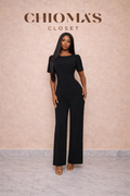 Black Short Sleeved Jumpsuit With Open Cross Back.